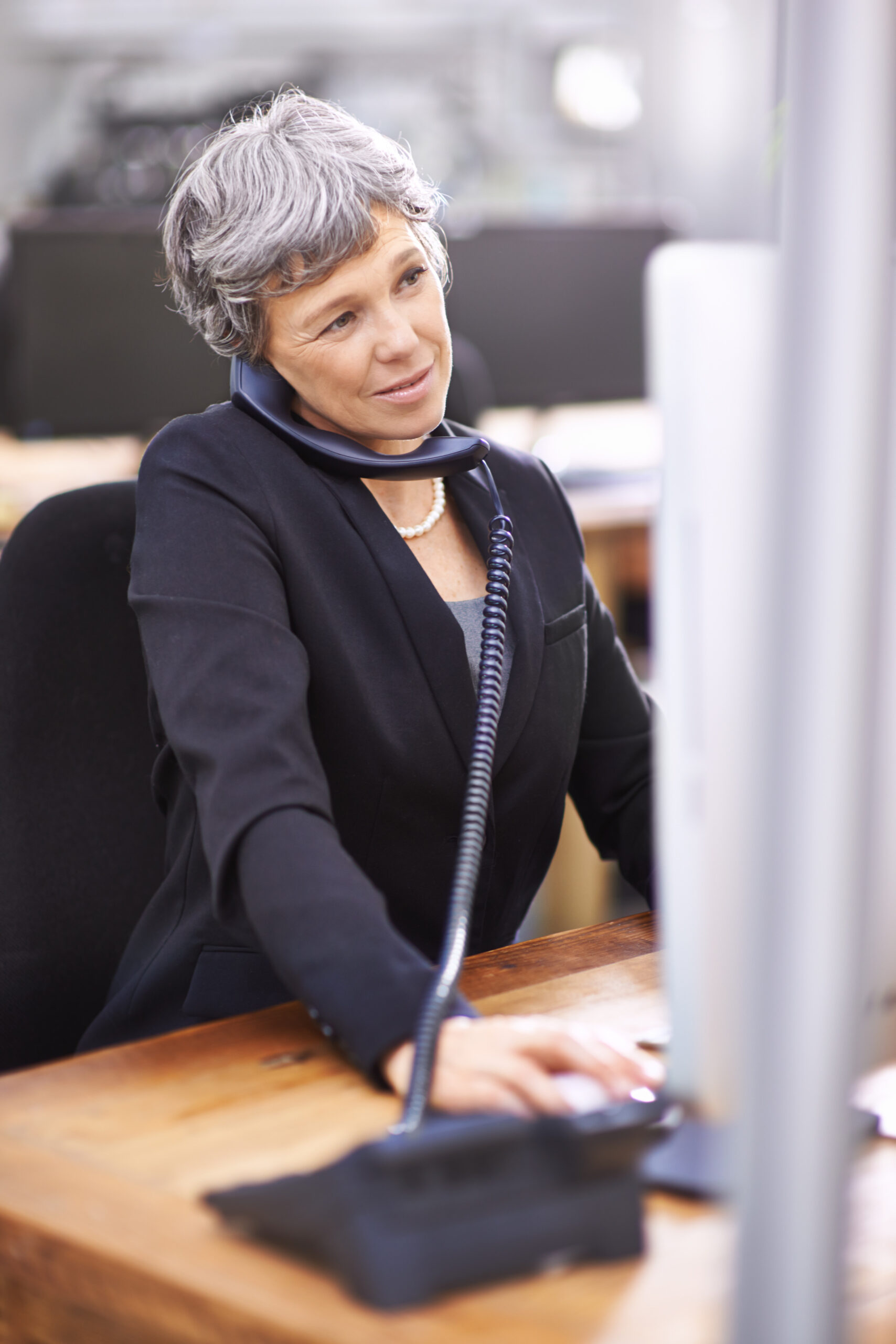 About us 3 business woman computer phone consultation call center office with typing web advice crm company conversation professional senior person with technology telemarketing scaled